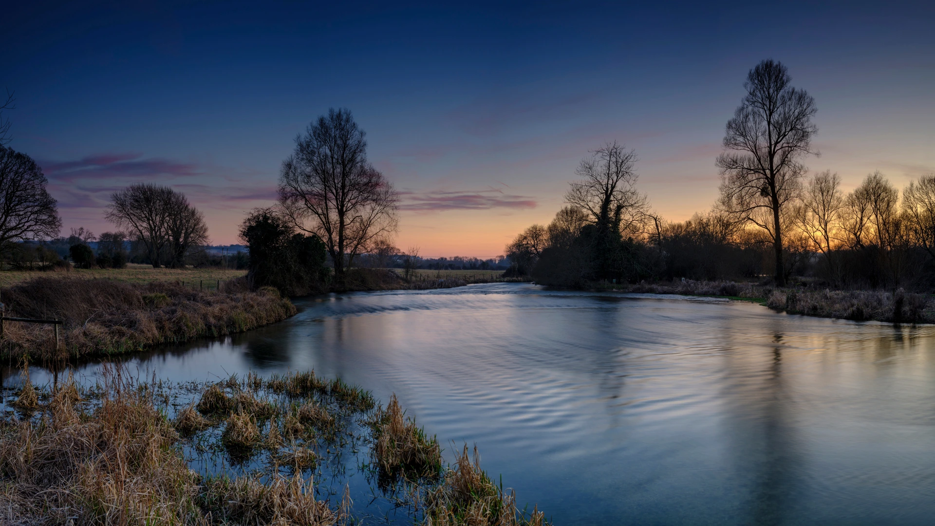 Evening view of the River Test with a beautiful sky and serene natural surroundings in Hampshire.