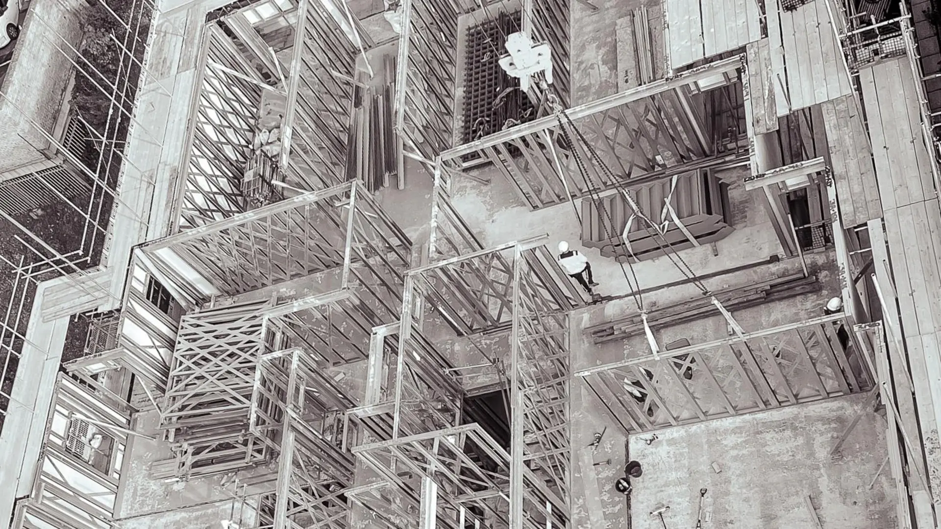 Close-up aerial view of a student accommodation construction site, with the floor structure clearly taking shape.