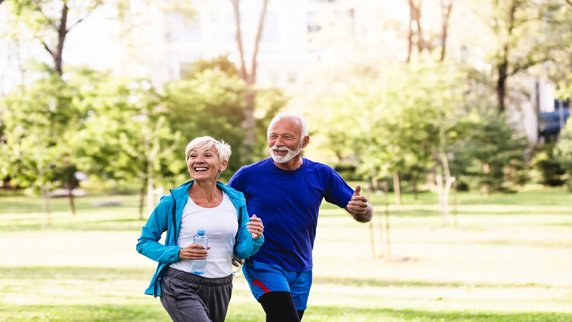 Couple running together, demonstrating how downsizing can lead to a healthier, more active lifestyle with a positive psychological impact.